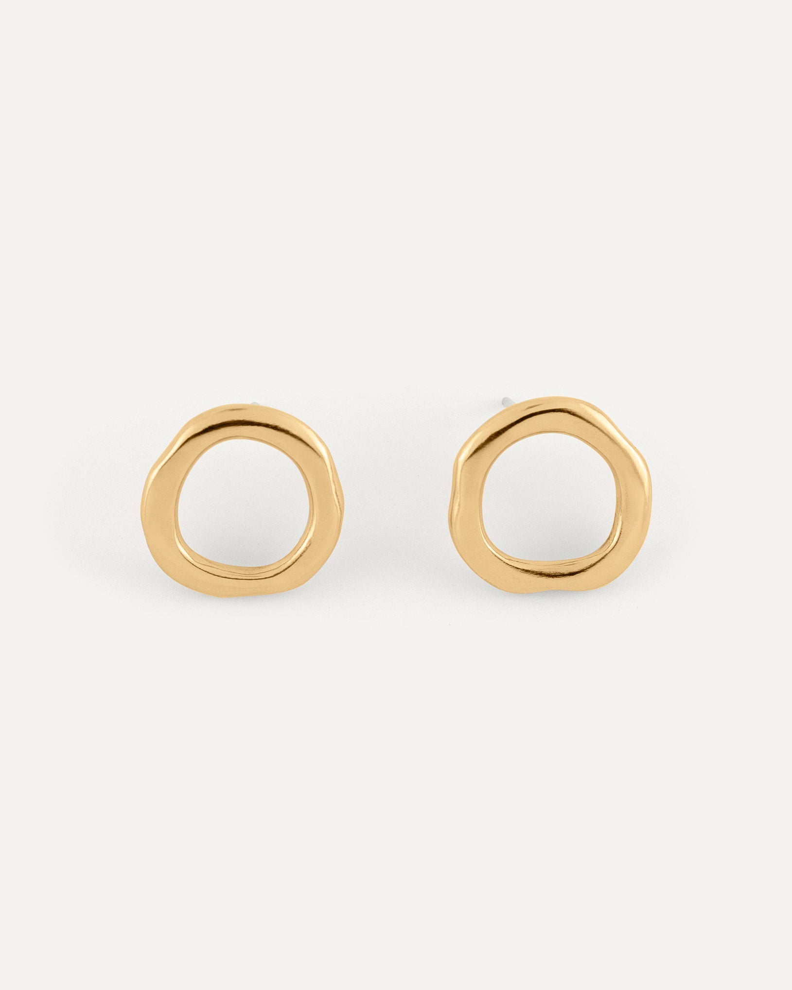  A pair of organic and sculptural oval brass earrings with high polished finish.