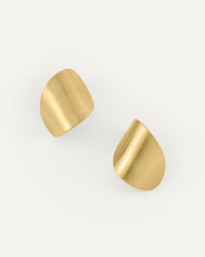 A pair of clean line and leaf-shaped brass earrings in soft satin finish.